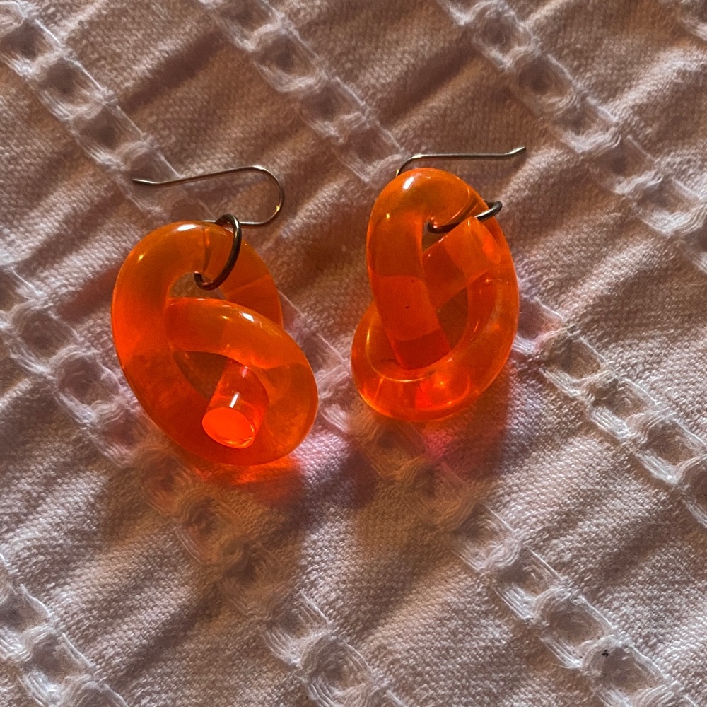 Corey Moranis neon orange knot earrings